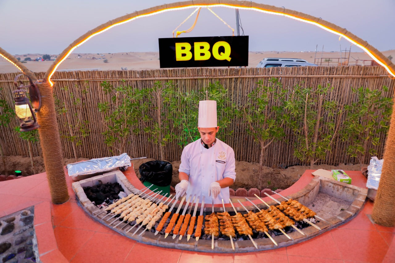 BBQ chef preparing food at the Standard Desert Safari camp in Dubai