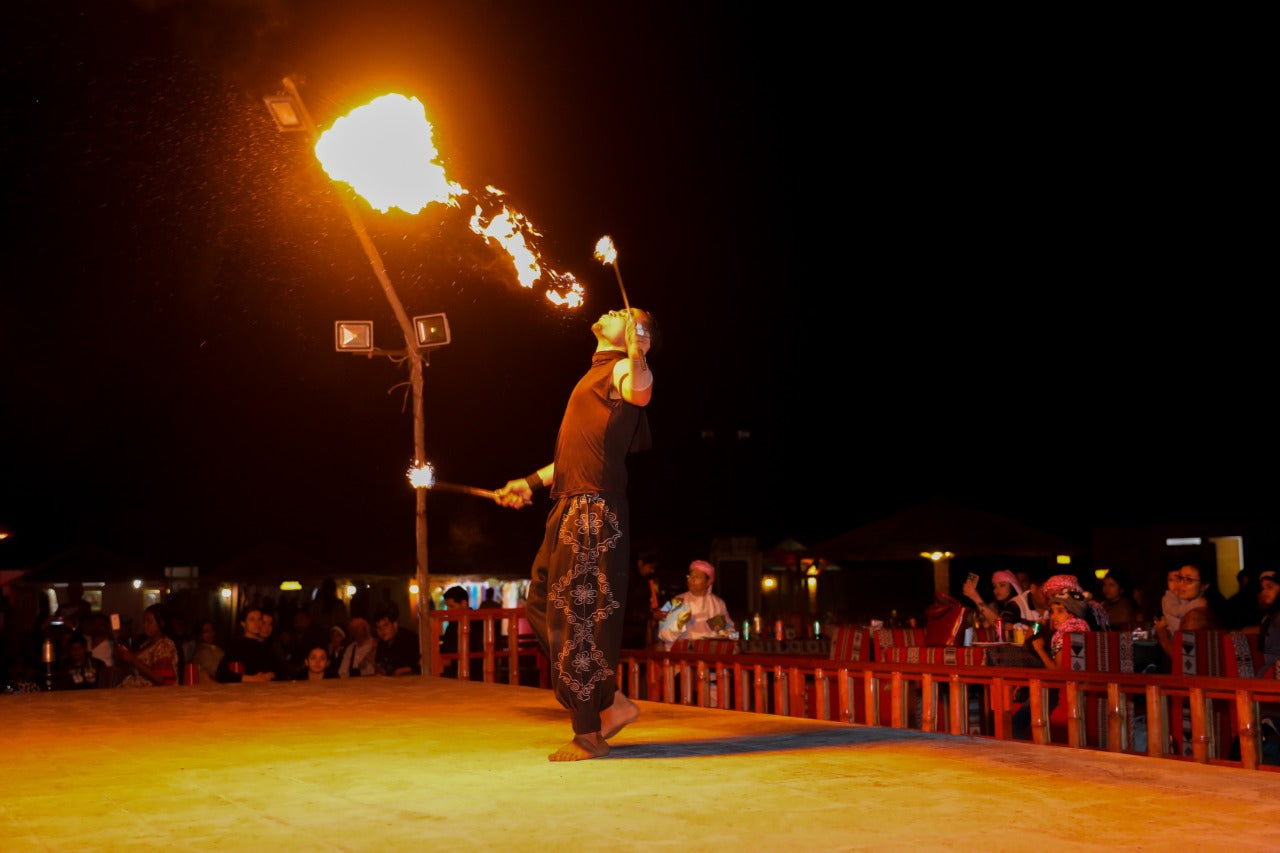 Exciting fire show performance at the Standard Desert Safari camp in Dubai entertaining guests