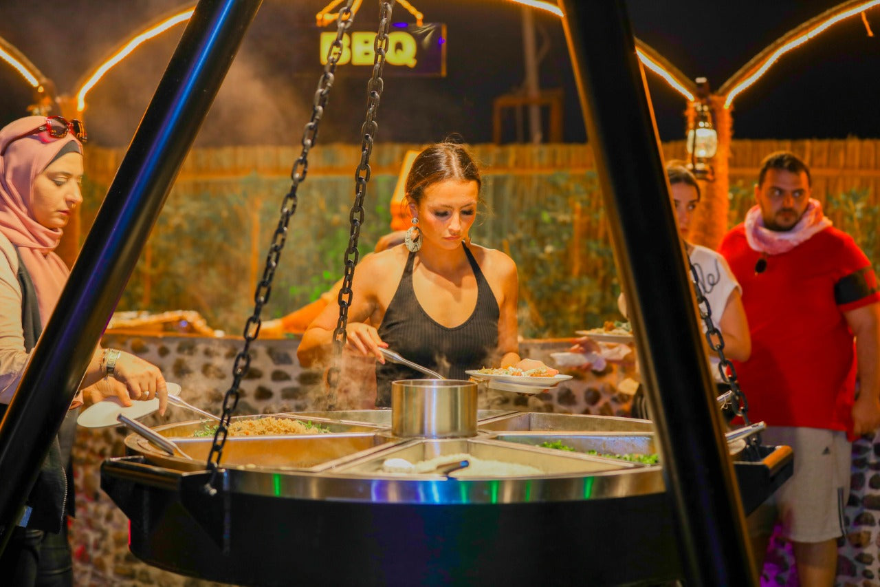 Guest enjoying buffet dinner at the Standard Desert Safari camp in Dubai