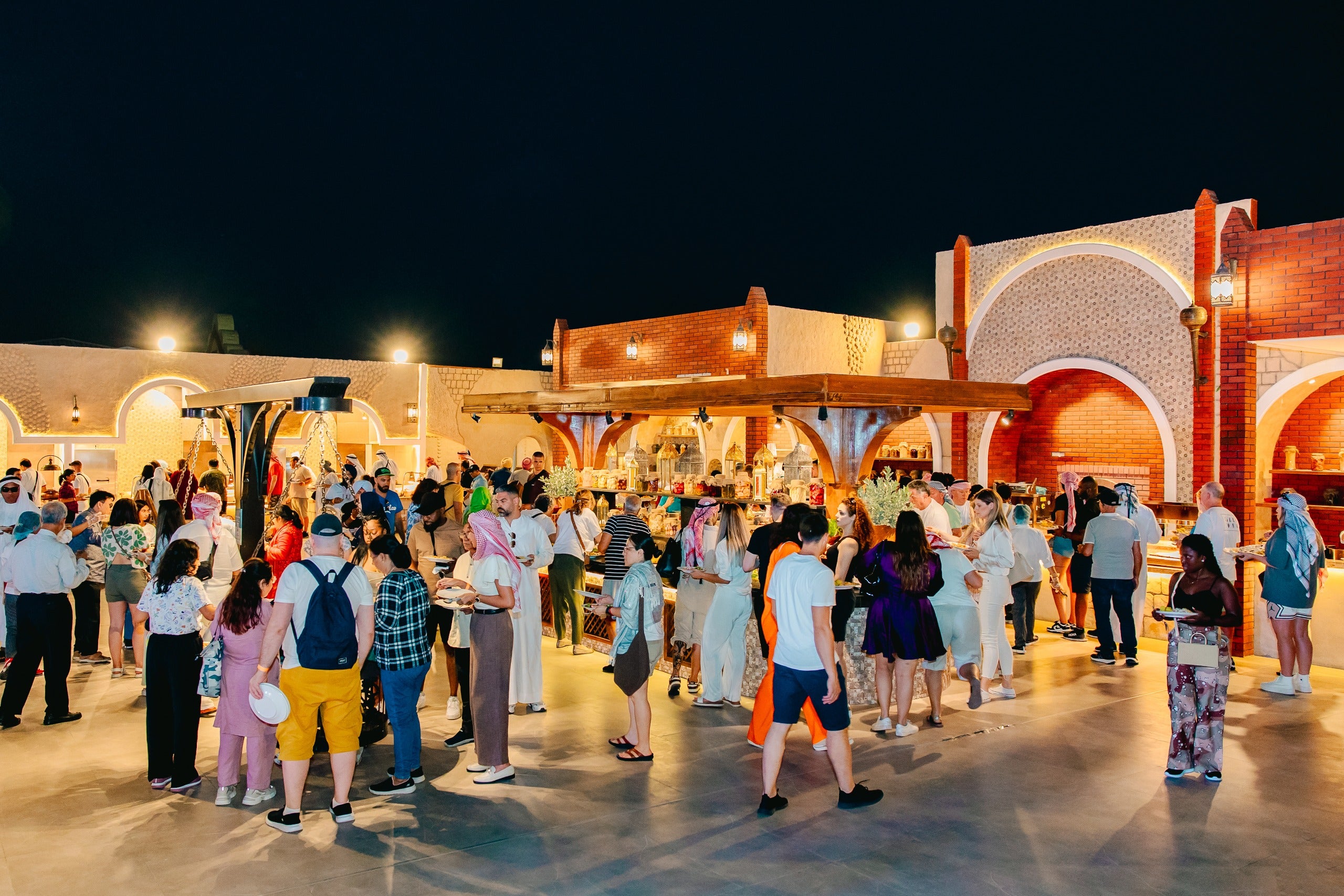 Guests enjoying a buffet meal at the desert safari camp in Dubai