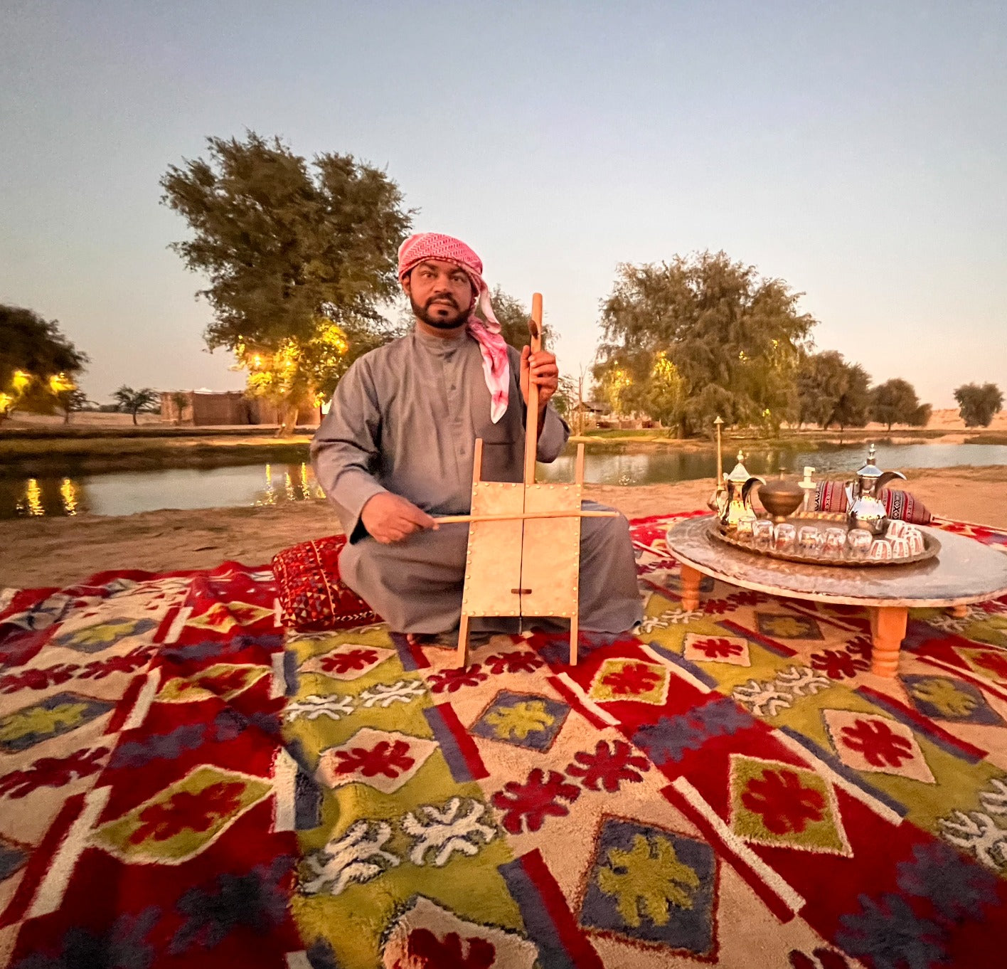 Musician playing a stringed instrument at the King Desert Safari in Dubai