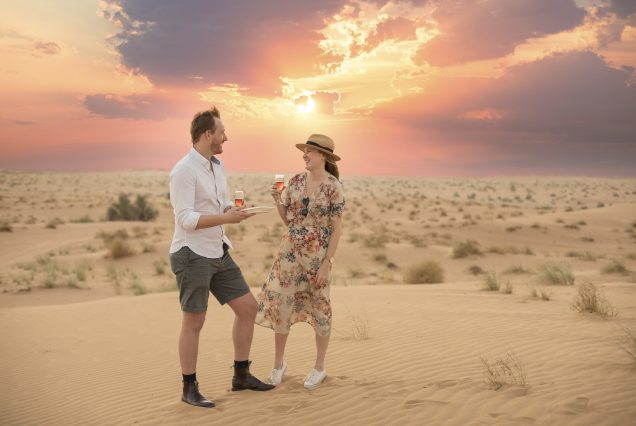 Platinum Safari vehicle in Dubai desert with sunset view
